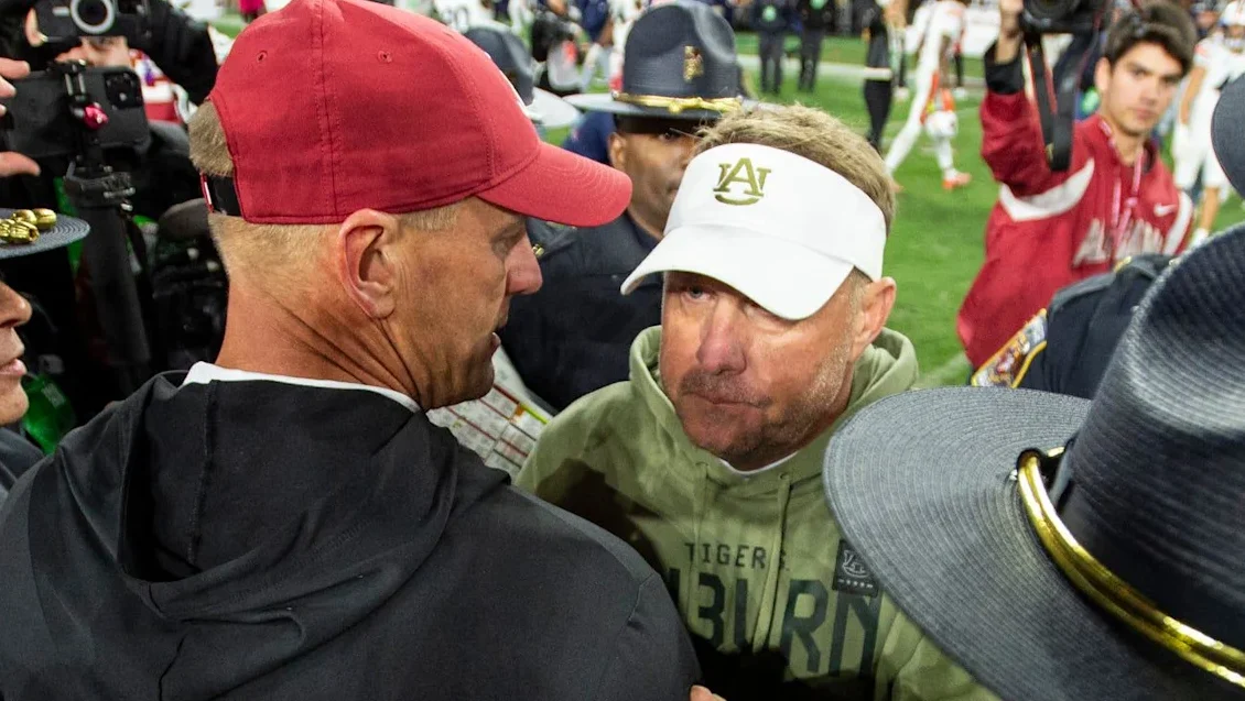 Alabama coach Kalen DeBoer and Auburn coach Hugh Freeze